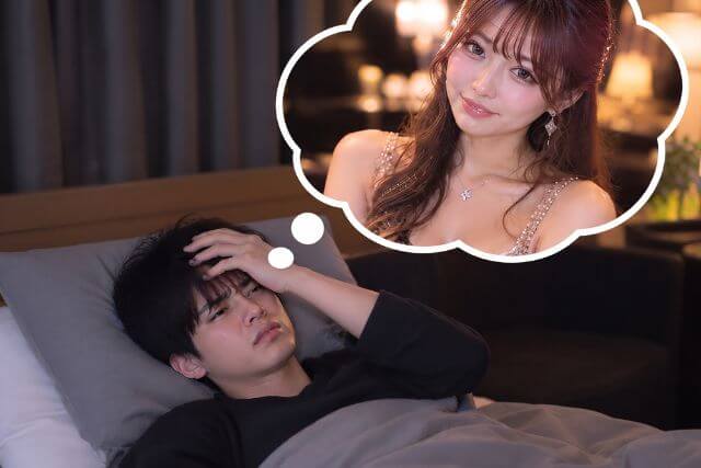 頭を抱えて寝る男性と吹き出しの中にドレスの女性