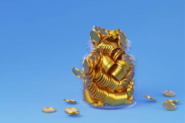 水色の背景に瓶に入った金色のコイン
